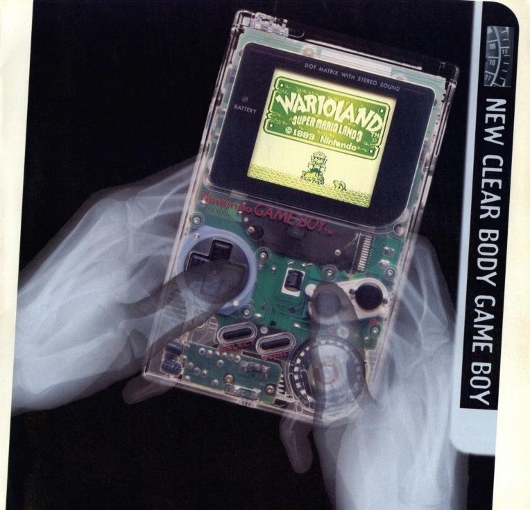 X-ray style view of hands holding a clear-bodied Nintendo Game Boy running Wario Land.